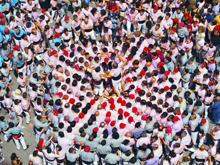 group of people forming a human castel